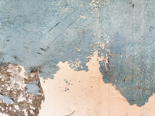 Distressed Wall Textured blue paint peeling revealing aged concrete, vintage style background