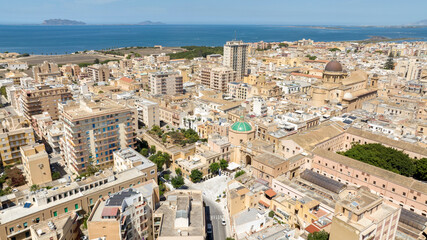 Naklejka premium Aerial view of Porta Garibaldi, which was one of the entrances to the historic center of Marsala, in the province of Trapani, Sicily, Italy. In background is Mediterranean Sea.