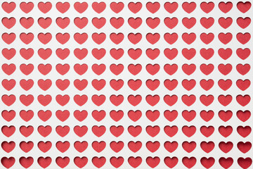 Background of multiple red hearts framed by white.  Love, valentine's day background or template.