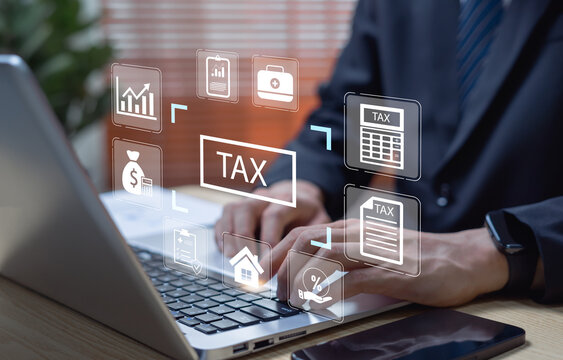 Businessman calculating tax payment and income report, financial accounting and taxation management concept, government finance, business audit, and compliance process.