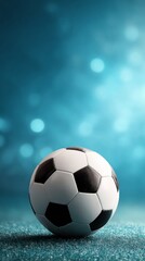 Fototapeta premium soccer ball on bright blue background with shiny lights and copy space