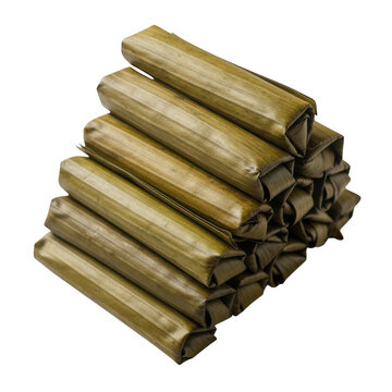 Stacked green cylinder food parcels tied with string close up shot