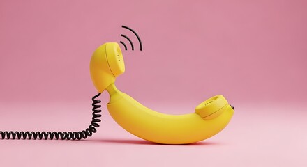 A banana is creatively transformed into a telephone handset with a coiled cord, set against a solid pink background.