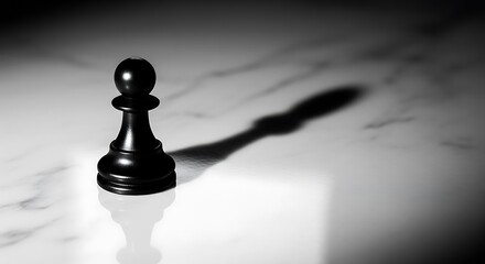 A single black chess pawn stands on a white marble surface, casting a long, dramatic shadow, creating a sense of strategy and contemplation.