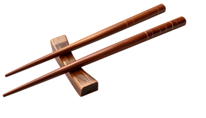 Elegant wooden chopsticks rest on a wood block