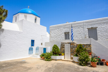 White Greek church with blue dome in Lagada village on Amorgos island. Cyclades, Greece