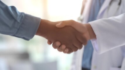 Close-up View of Doctor and Patient Handshake After Consultative Examination