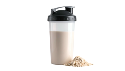 Protein shake in shaker with pile of powder against black backdrop