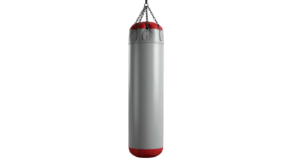 Tall, neutral punching bag hangs centered, dark backdrop