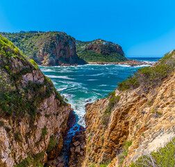 Fototapeta premium A view down a ravine on West Head headland and across the strait of the knysna river, South Africa in Springtime