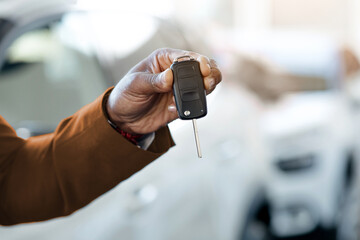 Auto Sale Concept. Closeup Of Car Keys In African American Man Hand, Unrecognizable Male Dealership...