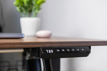 Modern electric standing desk control panel displaying 73.9, providing ergonomic flexibility and...