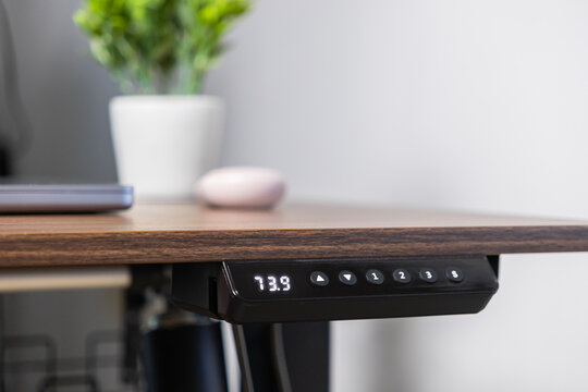 Modern electric standing desk control panel displaying 73.9, providing ergonomic flexibility and adjustable height settings for a productive home office setup