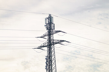 Powering the future and bridging connections, a communication tower reaches for the cloudy sky