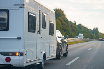 Onto the Open Road heading Westward with a Trailer on the Asphalt of the Highway