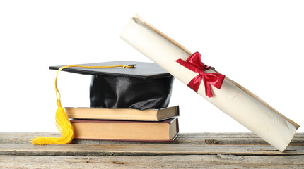 Diploma, books and graduation hat on wooden table against white background