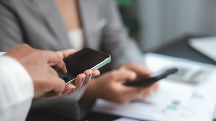 Business Team Using Smartphone for Communication and Data Sharing