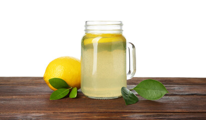 Tasty lemonade with mint and fresh fruit on wooden table against white background