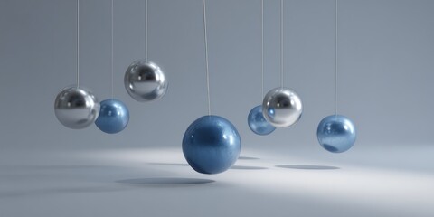 Hanging metallic and blue spheres cast shadows on a light surface.