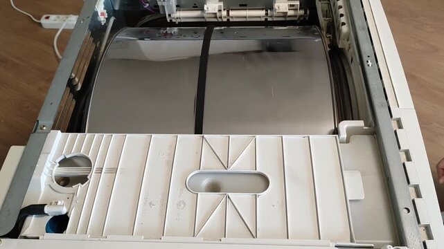 The dryer works without the top cover, the drum is spinning.