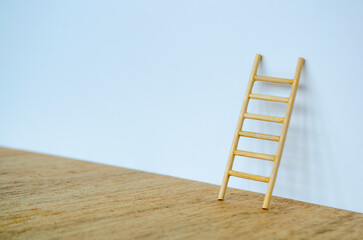 Side view of small ladder on white cover background with customizable space for text.