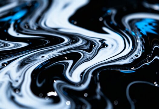 Abstract macro of white and blue paint swirling in a black liquid, creating a dynamic marbled effect.