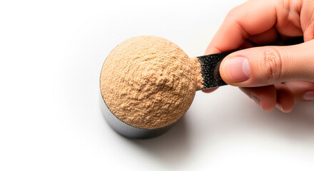 Close-up of a Hand Holding a Black Scoop Full of Brown Whey Protein Powder Against a White Background