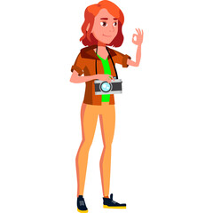 Young Woman Tourist With Camera Showing Ok Gesture Wearing Brown Jacket Green Shirt And Orange Pants In Studio