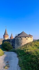 Kamianets-Podilskyi Fortress, medieval castle, Ukraine, tourism, history, grand architecture, autumn, sunny day, fortification, landmark