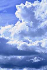 A beautiful sunny bright heaven cloudscape with a clear blue sky and clean clouds