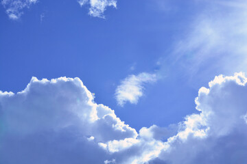 A beautiful sunny bright heaven cloudscape with a clear blue sky and clean clouds