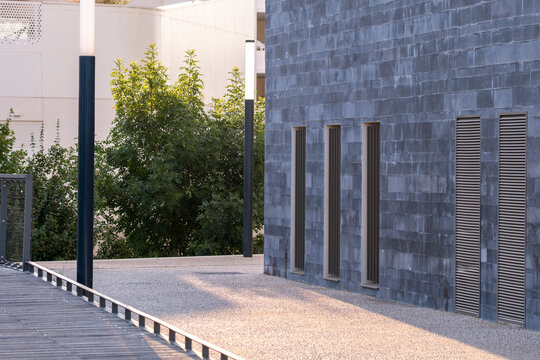 Minimal public space surrounded by urban architecture and open empty plaza design, featuring modern structure and balanced geometry in a modern European city under even daylight tones.