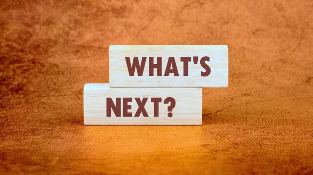The conceptual phrase WHAT'S NEXT it appears on a wooden bar., business concept.
