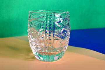 Crystal glass glass on a three-tone background.