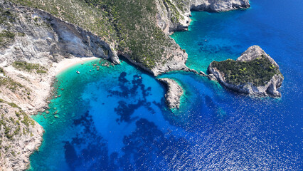 Aerial drone photo of not so famous paradise bay and caves of Saint Andrews islet creating a blue...