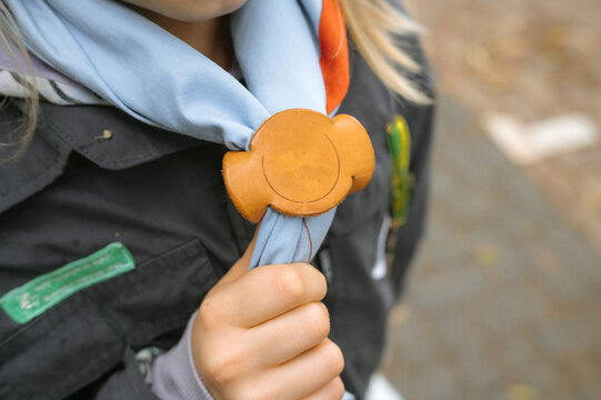 Boy Scout Anniversary Week, Scout Sunday, Scout Sabbath Young caucasian girl with scouting uniform and neckerchief slide