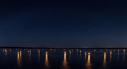 Obraz premium Night Landscape with Glowing Lights: Serene Lake or Ocean at Dusk with Numerous Artificial Lights Reflected on Water Surface Under Starry Sky