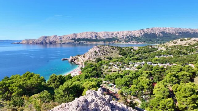 Breathtaking coastal panorama overlooking turquoise waters and lush greenery. Ba&scaron;ka, Krk island, Croatia