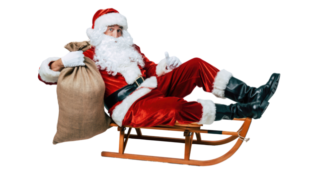 Santa claus in red suit and hat sitting on a wooden sled holding a sack against a black background