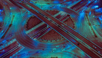 Expressway, Self-driving autonomous electric cars of the future with HUD elements move along a busy traffic intersection. Concept: Artificial Intelligence, Car Scan, GPS Tracking, Smart Roads, IoT