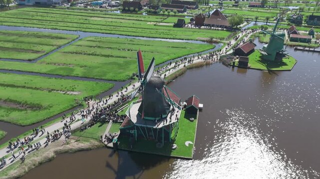 Aerial 4K Drone Footage of Zaanse Schans Windmills near Amsterdam, Netherlands &ndash; Scenic Dutch Village with Traditional Houses and River View