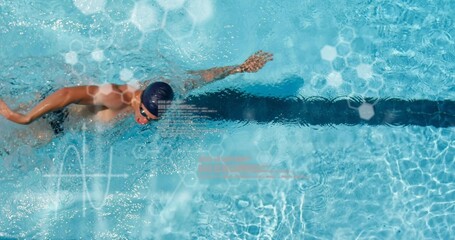 Performing front crawl male swimmer wearing swim cap and goggles over lane line, hexagon overlays