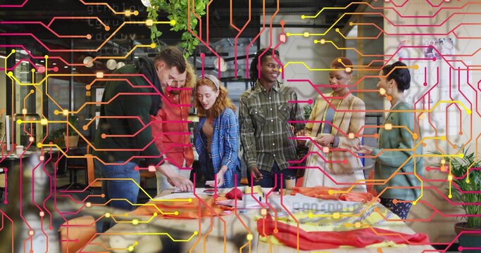 Collaborating colleagues arranging fabric swatches on table in design studio, with digital overlay