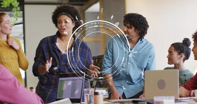 Gesturing woman presenting digital infographic overlay at meeting room with laptops - Powered by Adobe