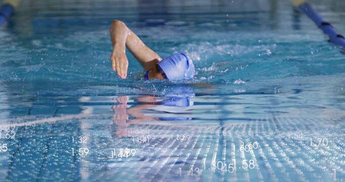 Swimming competitive swimmer wearing blue swim cap and goggles in clear pool water, with lane ropes - Powered by Adobe