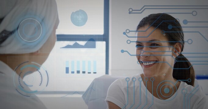Exchanging data between provider wearing coat and patient in clinic with data overlay, copy space