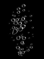 Clear water bubbles rising on black background, captured in macro detail with contrast and clarity. Perfect for clean design, freshness, science, purity, and modern abstract visuals.