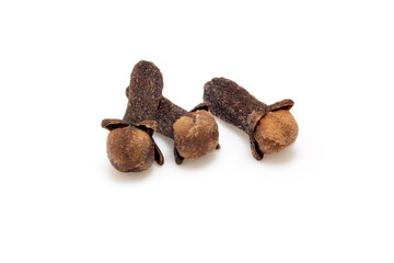 Three dried clove buds isolated on white, aromatic spice macro