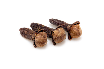 Three dried whole cloves isolated on white, aromatic spice closeup