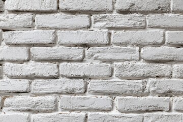 Fototapeta premium Textured white brick wall featuring visible seams and natural imperfections, showcasing varied brick sizes and shapes for a rustic, inviting ambiance ideal for interior design projects